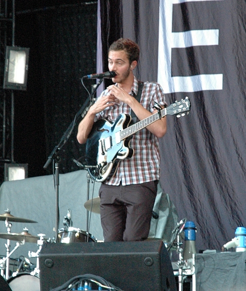 Tom Smith adjusted his invisible tie on stage. He want's to look his best you know. Manchester (2008)