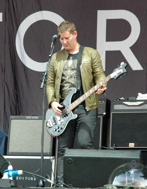 Russell Leetch playing his Bass guitar that's what he's there for. Manchester (2008)