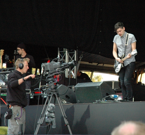 A camera man makes sure the crowd catch every detail of Chris Urbanowicz's guitar playing. Manchester (2008)