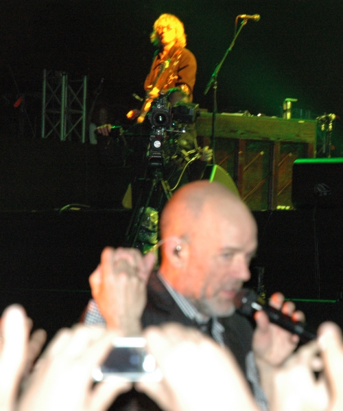 Mike Mills looks on as Michael Stipe plays with the crowd hopefully, one day, Mike Mills will be brave enough to come down and say hello. Manchester (2008)