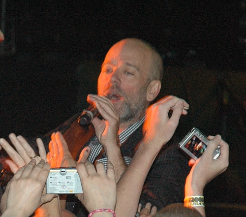 An R.E.M. fans tries to photograph the inside of Michael Stipe's nose. Manchester (2008)