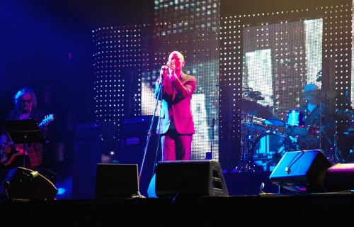 Michael Stipes stands in the pretty pink lights. Manchester (2008)