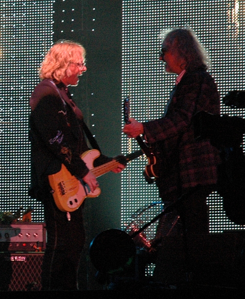Mike Mills plays a tune with the support guitarist. Manchester (2008)