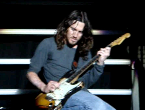 John comes to the front of the stage to play 'Under the bridge', Derby (2006)