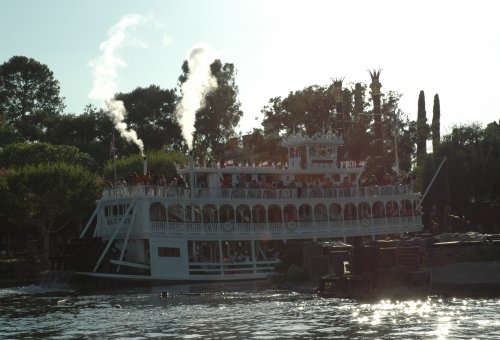 An old fashioned steamboat steams around the lake at Disneyland. Los Angeles (2007)